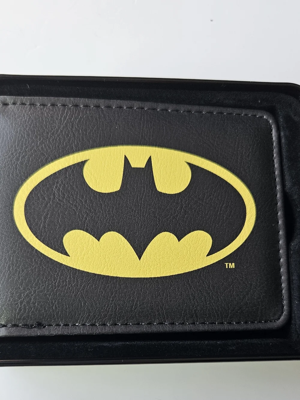 officially licensed DC Comics Batman Bifold Wallet resting inside its protective